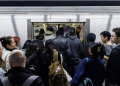 People enter a subway train inside a Toronto Transit Commission station in downtown Toronto, Saturday, April 1, 2023.