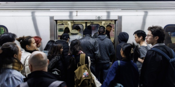 People enter a subway train inside a Toronto Transit Commission station in downtown Toronto, Saturday, April 1, 2023.